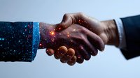 Business handshake with cosmic galaxy effect overlay, glowing particles and stars create magical atmosphere in professional greeting between two partners.