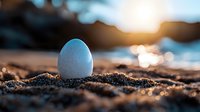 White egg nestled in golden sand at sunset with sparkling ocean bokeh in background, warm tones and shallow depth of field create dreamy coastal atmosphere.