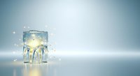 Light bulb frozen in ice cube with glowing filament and sparkling particles, symbolizing innovation, energy efficiency, and creative ideas for business, technology, and sustainability concepts.