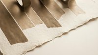 Neutral beige and brown fabric color swatches arranged in gradient pattern for interior design and textile selection projects.