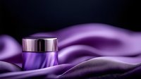 Luxurious purple cosmetic cream jar on flowing silk fabric background with dramatic lighting and reflective metallic lid, elegant beauty product photography.