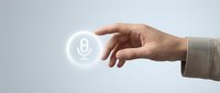 Business hand reaching for glowing microphone icon representing voice technology, audio recording, podcasting, and digital communication solutions.