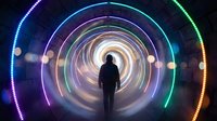 Silhouette of person walking through futuristic tunnel with colorful neon light rings creating perspective depth and sci-fi atmosphere for technology concepts.