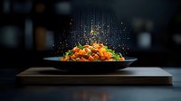Fresh salmon poke bowl with vegetables and seasonings on black plate against dark background, dramatic food photography with falling spices.