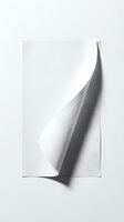 Minimalist white paper sheet with curved corner and shadow on clean background for modern design projects and creative layouts.