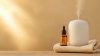 Spa wellness setup with essential oil bottle, aromatherapy diffuser and soft towel in warm golden sunlight for relaxation and self-care rituals.
