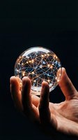 Hands holding glowing crystal sphere with illuminated network connections representing global communication, technology innovation and digital transformation.