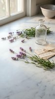 Fresh lavender sprigs with glass bottle and vintage letters on marble surface near window for aromatherapy and natural wellness concepts.