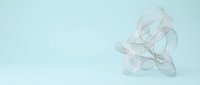 Transparent glass twisted knot sculpture on light blue background, isolated for design and commercial use.