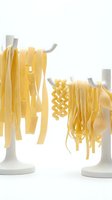 Fresh pasta varieties hanging on white drying rack stands, including fettuccine and fusilli shapes. Suitable for cooking, food preparation, Italian cuisine, and culinary content.