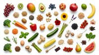 Colorful assortment of fresh organic fruits, vegetables, nuts, seeds and superfoods arranged on white background for healthy eating and nutrition concepts.