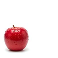 Fresh red apple with water droplets isolated on white background for healthy eating and nutrition concepts.