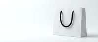 White paper shopping bag with black rope handles on clean background for retail branding and commercial design projects.