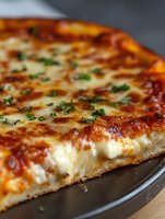 Close-up view of freshly baked cheese pizza with melted mozzarella, tomato sauce and chopped herbs on dark pan, showing texture and layers of crust.