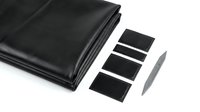 Black plastic sheeting material with adhesive strips isolated on white background for construction waterproofing and repair projects.