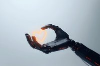 Robotic arm holding glowing heart shape against light background, symbolizing artificial intelligence and emotional intelligence in technology advancement.