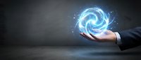 Businessman hand holding glowing blue energy spiral with particles and light effects against dark background for technology and innovation concepts.