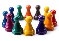 Colorful wooden game pieces arranged in circle formation on white background, showing diversity and teamwork concept for business presentations and strategy planning.