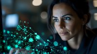 Hispanic woman looking at glowing green digital network visualization, technology interface with connected nodes and data points in dark environment.