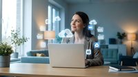 Professional businesswoman working on laptop with cloud computing icons and digital technology symbols floating around modern office workspace.