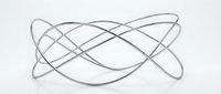 Abstract flowing silver metallic ribbons intertwining in elegant curves on white background. Modern minimalist design element for luxury branding and decoration.
