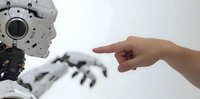 Human hand pointing at humanoid robot face in white minimalist setting, representing human-machine interaction and artificial intelligence technology.