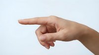 Human hand pointing finger gesture isolated on white background for design and presentation use.