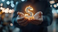 Glowing dollar sign floating above cupped hands with magical light effect and bokeh background, representing financial success, wealth management and prosperity.