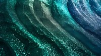 Cosmic abstract background with flowing turquoise and navy waves decorated with sparkling stardust effect creates magical atmosphere for luxury designs.