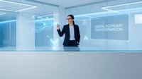 Businesswoman in formal attire presenting digital economy transformation concepts in modern glass office with blue lighting and technology interface displays.
