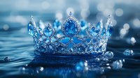 Royal crown with blue gemstones and crystals on reflective water surface with bokeh lights and droplets, creating magical atmosphere for fairy tale designs.