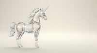 Elegant crystal glass unicorn figurine with flowing mane and spiral horn on neutral background for fantasy decor and magical themed designs.