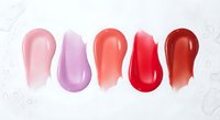 Colorful lip gloss swatches in pink red purple shades on white background for cosmetic beauty makeup product display and color selection guide.