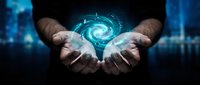 Hands holding glowing spiral galaxy energy orb against dark digital background, representing innovation, technology, future vision, and cosmic power for business concepts.