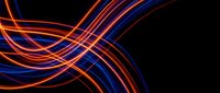 Dynamic flowing light trails in vibrant orange and blue colors creating elegant curved lines against black background for modern digital design projects.