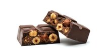 Dark chocolate bars filled with roasted hazelnuts and crispy cereal pieces, isolated on white background. Perfect for food packaging, confectionery advertising, and bakery designs.