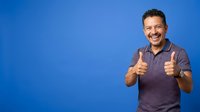 Man in casual brown polo shirt giving double thumbs up gesture against solid blue background, expressing approval, success and positive attitude for business and lifestyle concepts.