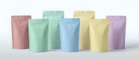 Colorful pastel stand-up pouches in pink, mint green, blue and yellow arranged on white surface for product packaging and branding mockup designs.