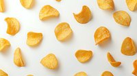 Scattered golden potato chips on white background, crispy fried snacks arranged in random pattern, isolated food elements for commercial and packaging design.