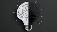 Creative light bulb with brain inside on dark background, combining innovation and intelligence concepts in minimalist black and white design style.