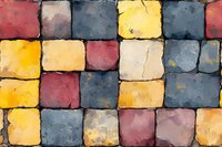 Colorful stone pavement pattern with yellow, red and blue cobblestones creating geometric mosaic texture, abstract background for design projects.