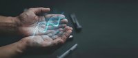 Hands holding glowing blue DNA double helix hologram against dark background representing genetic research, biotechnology innovation and medical science advancement.