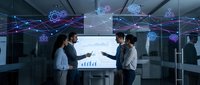 Diverse business team collaborating in modern office with holographic data visualization and network connections displayed on screen and floating above workspace.
