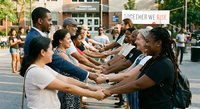 Diverse group of people holding hands in unity circle outdoors during community gathering promoting togetherness and social connection in urban setting.