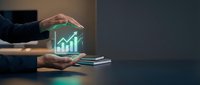 Businessman hands holding smartphone with glowing holographic growth chart, financial success and investment concept in dark office setting.