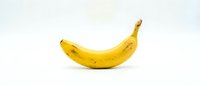 Fresh yellow banana isolated on white background, ready for food and nutrition design projects, packaging, and culinary content.