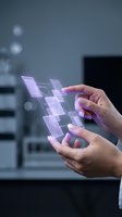 Close-up of hands interacting with glowing purple holographic interface displaying connected digital blocks, representing technology, innovation, and future digital transformation in business applications.