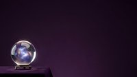 Crystal ball with glowing nebula and stars inside on dark purple background, suitable for mystical, fortune telling, and spiritual design projects.