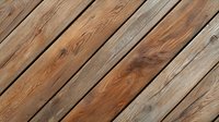 Diagonal wooden planks with natural grain pattern and weathered texture create rustic background. Brown and gray tones in aged timber deck surface.