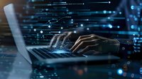 Male hands typing on laptop keyboard with digital data visualization overlay, representing cybersecurity, programming, or data analysis in dark tech environment.